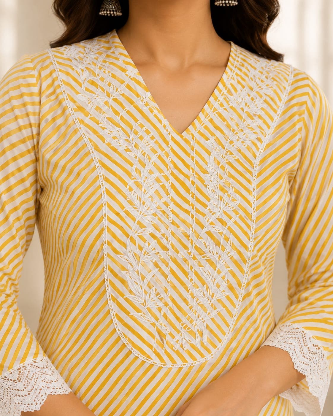 Close-up of hand block-printed cotton with threadwork detail